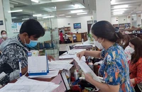 Người dân đến thực hiện các thủ tục tại cơ quan BHXH TP.HCM.