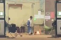 Clip ghi cảnh bé 16 tháng tuổi bị nhân viên cây xăng ném xuống nền bê tông
