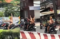 Vừa chạy xe vừa thả tay múa quay cuồng, cô gái sẽ bị xử lý ra sao?