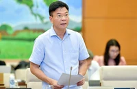 Bộ trưởng Bộ Tư pháp Lê Thành Long trình bày về dự án Luật Đấu giá tài sản (sửa đổi).