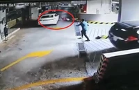 Tài xế lái xe ô tô điên cuồng chạy trong hầm xe chung cư, húc văng 1 phụ nữ