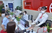 Vay vốn ngân hàng được xem là một trong những kênh huy động khả quan đối với doanh nghiệp. Ảnh minh họa: P.MINH