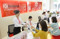 Ngân hàng Nhà nước vừa điều chỉnh hạ lãi suất lần thứ ba trong năm nay. Ảnh: P.MINH