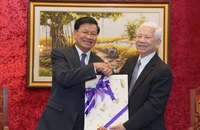 Tổng Bí thư, Chủ tịch nước Lào gặp nguyên Chủ tịch nước Nguyễn Minh Triết, Trương Tấn Sang