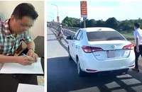 Một người bị phạt 13,5 triệu đồng,bị tạm giữ ô tô vì đỗ xe trên cầu xả rác xuống sông 