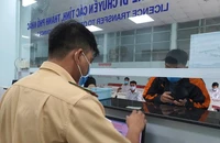  Bốn cơ quan sau có chức năng đăng ký, cấp biển số gồm Cục CSGT, Phòng CSGT, Công an cấp huyện và Công an cấp xã. Ảnh: THY NHUNG