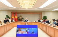 Việt Nam - Lào trao đổi về tình hình khu vực và quốc tế