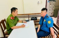 Nghi phạm Tuấn khai nhận tại cơ quan công an. Ảnh: CA.