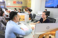 Theo Phó Thống đốc NHNN Đào Minh Tú: “Trong trường hợp cần thiết, trước khi hết hiệu lực khoảng ba tháng, NHNN có thể tiếp tục duy trì Thông tư 02 để gỡ khó cho nền kinh tế”. Ảnh: THÙY LINH