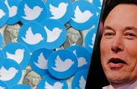 Tỉ phú Elon Musk và logo mạng xã hội Twitter. Ảnh: REUTERS