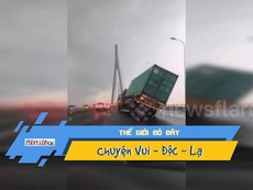 Gió mạnh xém quật ngã một xe container, đẩy ô tô xuống sông