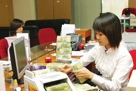 NHNN yêu cầu tăng cường an ninh giao dịch tiền mặt