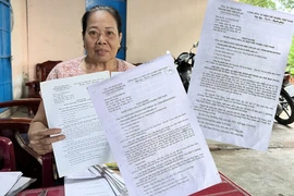 Nguyên đơn Nguyễn Thị Ngọc và hai bản án “cùng cha” nhưng phán quyết trái ngược.