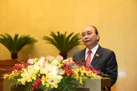 Thủ tướng Nguyễn Xuân Phúc báo cáo về công tác nhiệm kỳ của Chính phủ. Ảnh: VGP