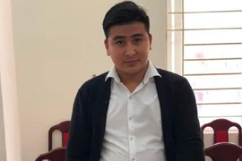 Bùi Văn Tấn tại cơ quan công an. Ảnh: ANTĐ