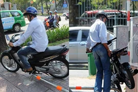 Có barie trên vỉa hè, xe máy vẫn cố vượt qua