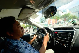 Xe Grab sẽ phải có hộp đèn ‘Taxi điện tử’?