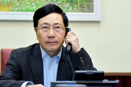Phó Thủ tướng Phạm Bình Minh tại cuộc điện đàm. Ảnh: BNG