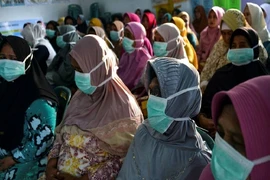 Một số người dân Indonesia cho rằng thông tin về COVID-19 không được cung cấp đầy đủ, Ảnh: AFP