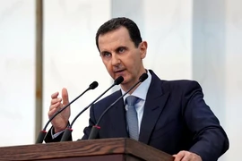 Tổng thống Bashar al-Assad phát biểu trước Quốc hội Syria tại Dinh Tổng thống hôm 12-8. Ảnh: REUTERS