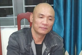 Trần Quang Trung tại cơ quan công an. Ảnh: CA