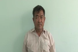 Nguyễn Quốc Việt bị bắt giữ sau hơn 14 năm bỏ trốn (ảnh VĂN VŨ)