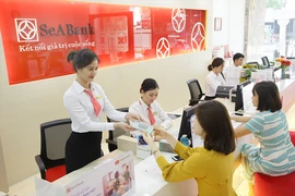 Ngân hàng Nhà nước vừa điều chỉnh hạ lãi suất lần thứ ba trong năm nay. Ảnh: P.MINH