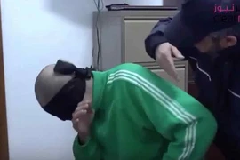Con trai của Gaddafi bị tra tấn trong tù