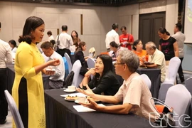 Các doanh nghiệp du lịch Việt Nam và Đài Loan đang trao đổi tại một sự kiện về du lịch- Ảnh: TCDL