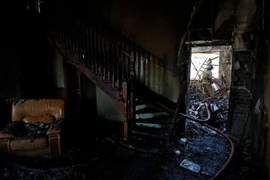 Nhà dân tan hoang trong các trận giao tranh giữa Nga và Ukraine ở tỉnh Donetsk. Ảnh: REUTERS