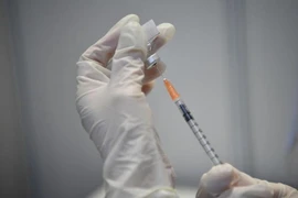 Singapore công nhận người tiêm vaccine Sinovac, Sinopharm của Trung Quốc. Ảnh: THE STRAITS TIMES 