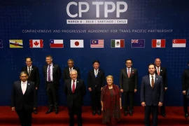 Đại diện các nước thành viên CPTPP tại lễ ký kết hiệp định ngày 8-3-2018 tại Santiago, Chile. Ảnh: REUTERS
