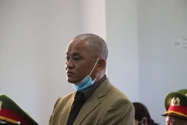 Cựu bí thư xã: 'Dùng búa ném chó chứ không giết người'
