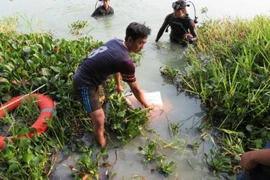 Tìm thấy thi thể 2 người chìm dưới hồ nước ở Bình Dương