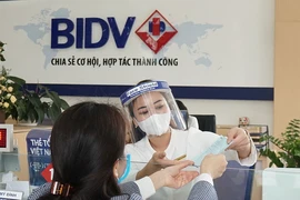 Giảm lãi suất cho vay, hỗ trợ doanh nghiệp vượt khó