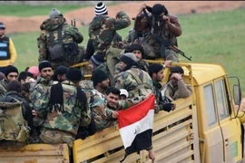 Quân chính phủ Syria hành quân về thị trấn Saraqeb, tỉnh Idlib.