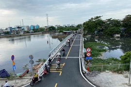 Cầu Phú Định thông xe sau mở rộng, giao thông hết ùn ứ
