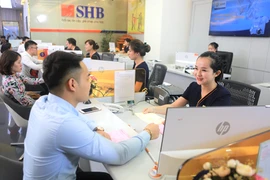 Theo Phó Thống đốc NHNN Đào Minh Tú: “Trong trường hợp cần thiết, trước khi hết hiệu lực khoảng ba tháng, NHNN có thể tiếp tục duy trì Thông tư 02 để gỡ khó cho nền kinh tế”. Ảnh: THÙY LINH