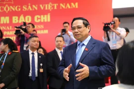 Thủ tướng Phạm Minh Chính thăm, động viên phóng viên tác nghiệp tại Đại hội XIV