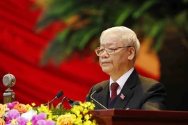 Tổng Bí thư Ban Chấp hành Trung ương Đảng, Chủ tịch nước CHXHCN Việt Nam Nguyễn Phú Trọng đọc Báo cáo chính trị của Ban Chấp hành Trung ương Đảng khóa XII và các văn kiện trình Đại hội. Ảnh: TTXVN