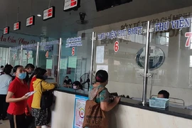 Người dân đến đăng ký khám chữa bệnh tại BV Gò Vấp. Ảnh: NGUYỄN HIỀN