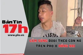 Cầm súng đuổi theo con nợ trên phố ở Đồng Nai