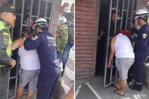 Ngó nghiêng nhà hàng xóm, phụ nữ bị mắc kẹt đầu vào song cửa