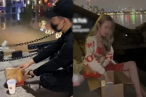 TikToker thả thức ăn nhanh xuống hồ Tây 'cầu nguyện cho Mèo Béo' có thể bị phạt