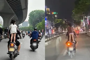 Cho trẻ đứng trên yên xe máy đang chạy: Coi thường tính mạng và pháp luật!