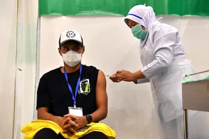 Aidil Zafuan, đội trưởng đội tuyển Malaysia, khoe ảnh tiêm vaccine ngừa COVID-19 mũi thứ hai.
