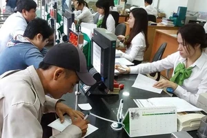 Đẩy mạnh chi trả chế độ bảo hiểm xã hội qua ngân hàng