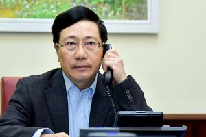 Phó Thủ tướng Phạm Bình Minh tại cuộc điện đàm. Ảnh: BNG