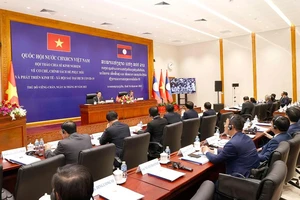 Việt Nam-Lào chia sẻ kinh nghiệm phát triển kinh tế-xã hội sau dịch COVID