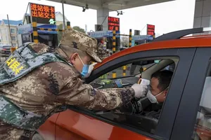 Có thêm 5 địa phương ở Trung Quốc giảm mức độ báo động dịch bệnh COVID-19. Ảnh: SCMP